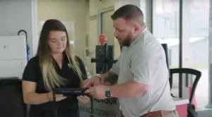 Two tire service customer service agents representing CAll tracking and AI.