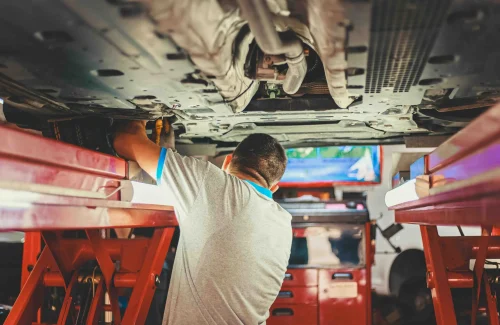the worker fixing the machines