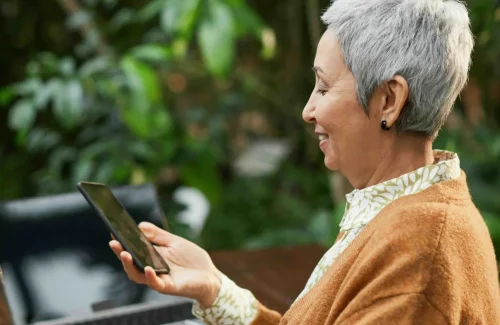 elderly woman using her phone